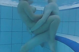 Teenie 18+ duo is having sex underwater! Big tits meet hefty dick! The water is warm and they are so horny!!!